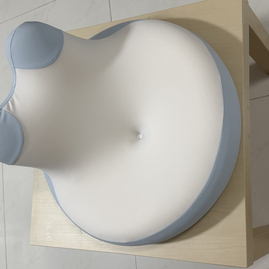 Top view of the blue and white CozyEnjoy Scroll Pillow showing its broad cushioned surface and raised back